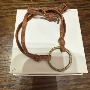 Minimalist leather strap and circular bracelet in preloved condition